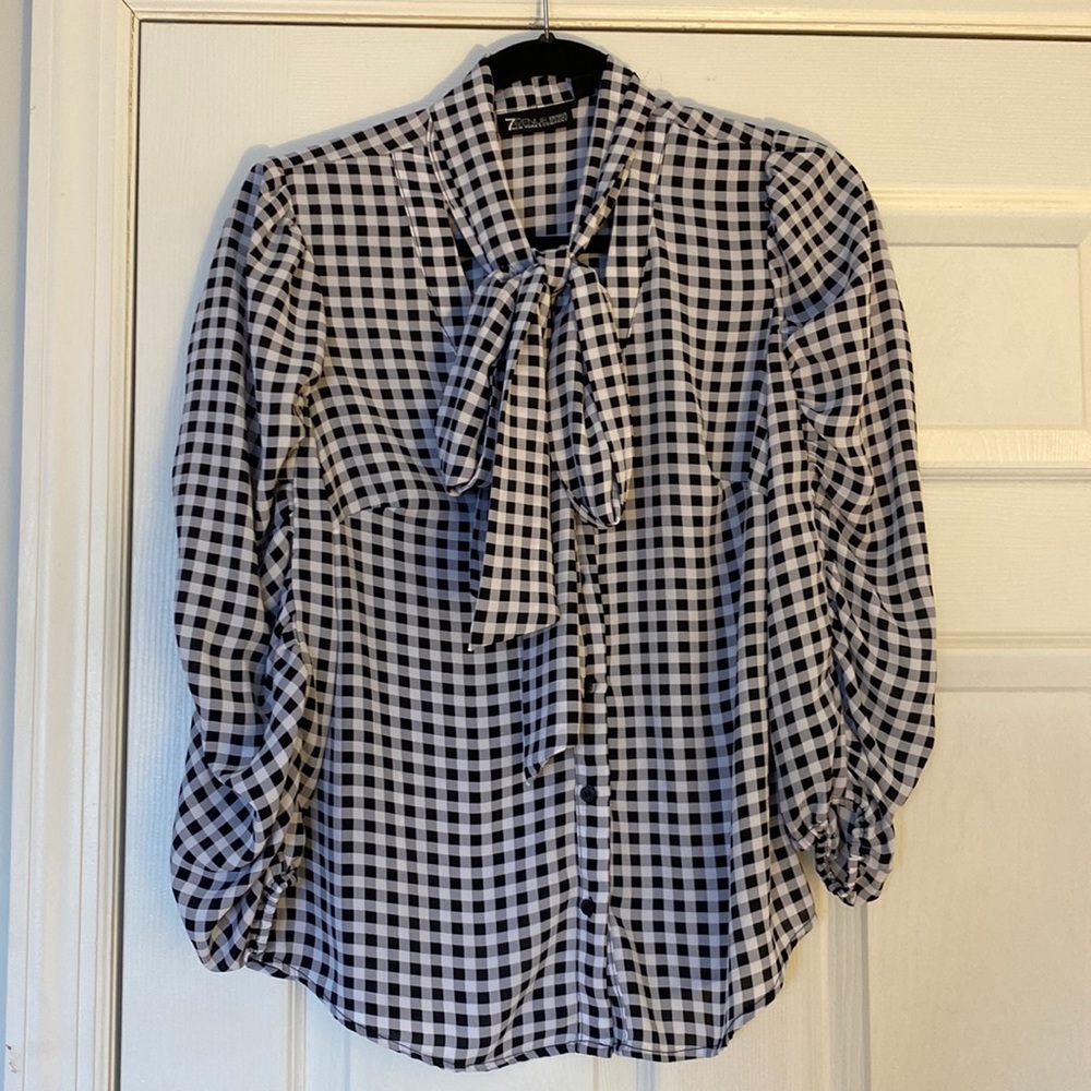Black and white checkered tie neck blouse . Size Small